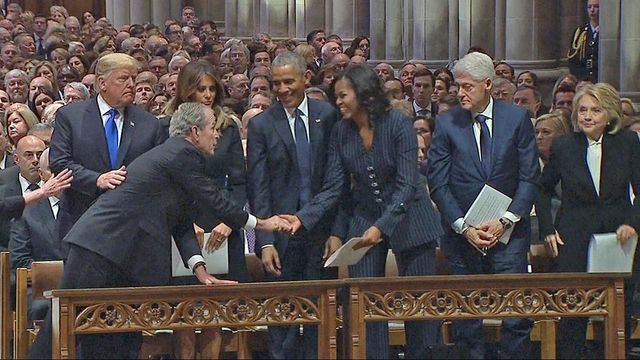 George W. Bush, Michelle Obama share sweet moment at funeral