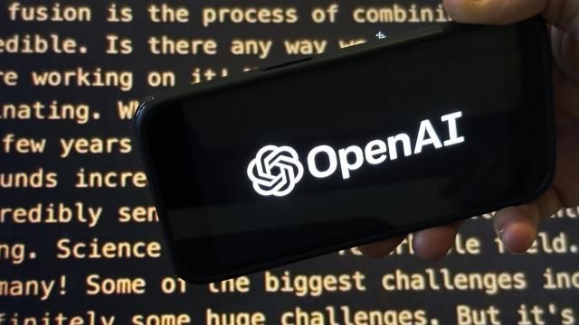 File - The OpenAI logo appears on a mobile phone in front of a screen showing part of the company website in this photo taken on Nov. 21, 2023 in New York. Negotiators will meet this week to hammer out details of European Union artificial intelligence rules but the process has been bogged down by a simmering last-minute battle over how to govern systems that underpin general purpose AI services like OpenAI's ChatGPT and Google's Bard chatbot. (AP Photo/Peter Morgan, File)