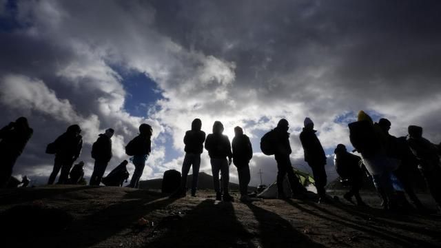 Asylum-seeking migrants wait to be processed in a makeshift, mountainous campsite after crossing the border with Mexico, Friday, Feb. 2, 2024, near Jacumba Hot Springs, Calif. (AP Photo/Gregory Bull) Asylum-seeking migrants wait to be processed in a makeshift, mountainous campsite after crossing the border with Mexico, Friday, Feb. 2, 2024, near Jacumba Hot Springs, Calif. (AP Photo/Gregory Bull)