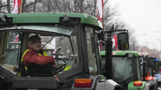 Polish farmers, angry at EU agrarian policy and cheap Ukraine produce imports which, they say, are undercutting their livelihoods, drive their heavy-duty tractors in protest outside the office of the regional governor, in Poznan, western Poland, Friday Feb. 9, 2024. (AP Photo/Czarek Sokolowski) Polish farmers, angry at EU agrarian policy and cheap Ukraine produce imports which, they say, are undercutting their livelihoods, drive their heavy-duty tractors in protest outside the office of the regional governor, in Poznan, western Poland, Friday Feb. 9, 2024. (AP Photo/Czarek Sokolowski)