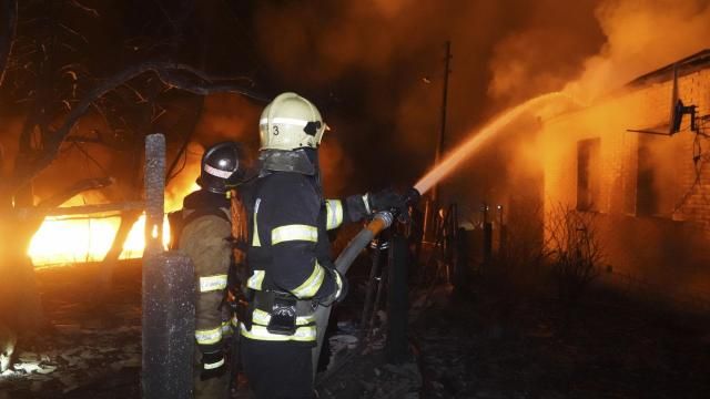 Firefighters extinguish a fire after a Russian attack on residential neighborhood in Kharkiv, Ukraine Saturday, Feb. 10, 2024. According to the city administration, about a dozen private houses were under fire and scores of people were evacuated after Russian drones strike on a residential area. (AP Photo/Andrii Marienko) Firefighters extinguish a fire after a Russian attack on residential neighborhood in Kharkiv, Ukraine Saturday, Feb. 10, 2024. According to the city administration, about a dozen private houses were under fire and scores of people were evacuated after Russian drones strike on a residential area. (AP Photo/Andrii Marienko)