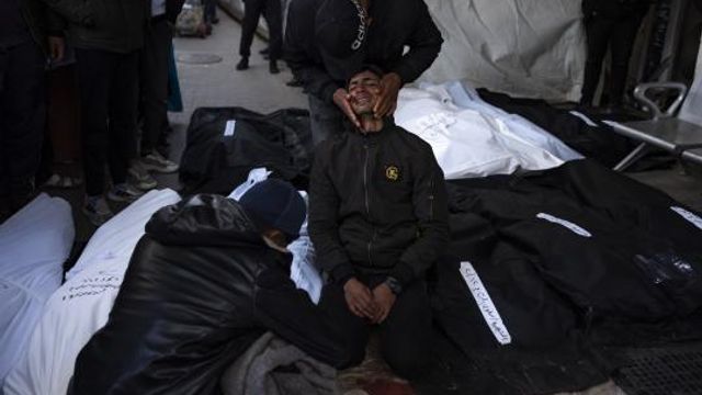 Palestinians mourn relatives killed in the Israeli bombardment of the Gaza Strip at a hospital morgue in Rafah, Monday, Feb. 12, 2024. The Israeli military said early Monday that it had rescued the two hostages from captivity in the Gaza Strip. The operation, which was accompanied by airstrikes, killed dozens of Palestinians, according to local health officials. (AP Photo/Fatima Shbair) Palestinians mourn relatives killed in the Israeli bombardment of the Gaza Strip at a hospital morgue in Rafah, Monday, Feb. 12, 2024. The Israeli military said early Monday that it had rescued the two hostages from captivity in the Gaza Strip. The operation, which was accompanied by airstrikes, killed dozens of Palestinians, according to local health officials. (AP Photo/Fatima Shbair)