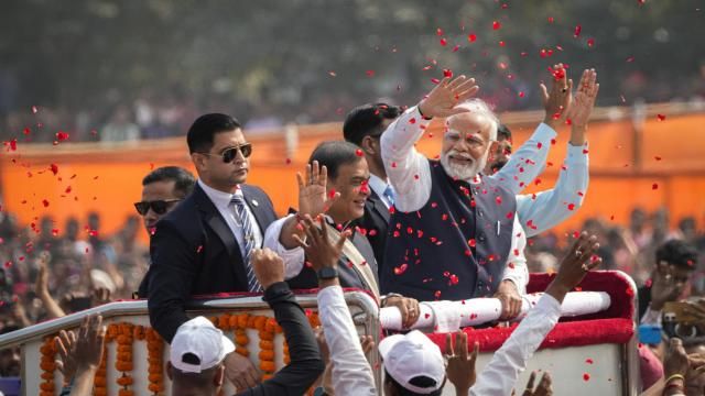 Flower petals are thrown to welcome the Indian Prime Minister Narendra Modi, wearing a waistcoat, as he arrives with Assam Chief Minister Himanta Bishwa Sarma, to his right, to address a public rally in Guwahati, India, Sunday, Feb. 4, 2024. (AP Photo/Anupam Nath) Flower petals are thrown to welcome the Indian Prime Minister Narendra Modi, wearing a waistcoat, as he arrives with Assam Chief Minister Himanta Bishwa Sarma, to his right, to address a public rally in Guwahati, India, Sunday, Feb. 4, 2024. (AP Photo/Anupam Nath)