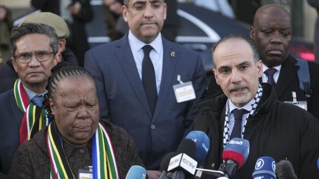 Accompanied with South Africa's Foreign Minister Naledi Pandor, left, Palestinian assistant Minister of Multilateral Affairs Ammar Hijazi addresses reporters after session of the International Court of Justice, or World Court, in The Hague, Netherlands, Friday, Jan. 26, 2024. The United Nations' top court has stopped short of ordering a cease-fire in Gaza in a genocide case but demanded that Israel try to contain death and damage in its military offensive in the tiny coastal enclave. South Africa brought the case and had asked the court to order Israel to halt its operation. (AP Photo/Patrick Post) Accompanied with South Africa's Foreign Minister Naledi Pandor, left, Palestinian assistant Minister of Multilateral Affairs Ammar Hijazi addresses reporters after session of the International Court of Justice, or World Court, in The Hague, Netherlands, Friday, Jan. 26, 2024. The United Nations' top court has stopped short of ordering a cease-fire in Gaza in a genocide case but demanded that Israel try to contain death and damage in its military offensive in the tiny coastal enclave. South Africa brought the case and had asked the court to order Israel to halt its operation. (AP Photo/Patrick Post)