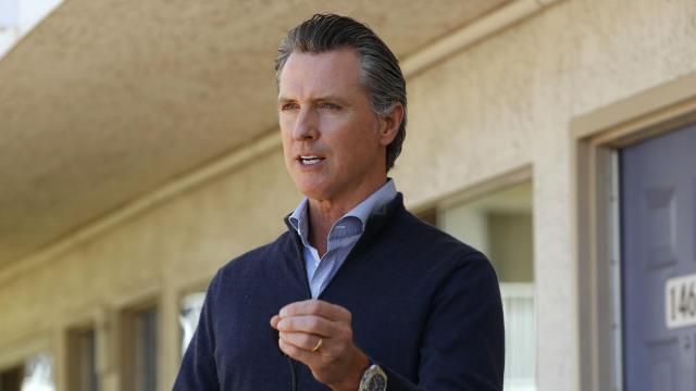 FILE - California Gov. Gavin Newsom gives an update on the state's initiative to provide housing for homeless Californians to help stem the coronavirus, during a visit to a Motel 6 participating in the program in Pittsburg, Calif., June 30, 2020. California cities and counties still don't know how much they'll have to pay for Newsom's pandemic program to house homeless people in hotel rooms after the Federal Emergency Management Agency said in October 2023 that it was limiting the number of days eligible for reimbursement. (AP Photo/Rich Pedroncelli, Pool) FILE - California Gov. Gavin Newsom gives an update on the state's initiative to provide housing for homeless Californians to help stem the coronavirus, during a visit to a Motel 6 participating in the program in Pittsburg, Calif., June 30, 2020. California cities and counties still don't know how much they'll have to pay for Newsom's pandemic program to house homeless people in hotel rooms after the Federal Emergency Management Agency said in October 2023 that it was limiting the number of days eligible for reimbursement. (AP Photo/Rich Pedroncelli, Pool)
