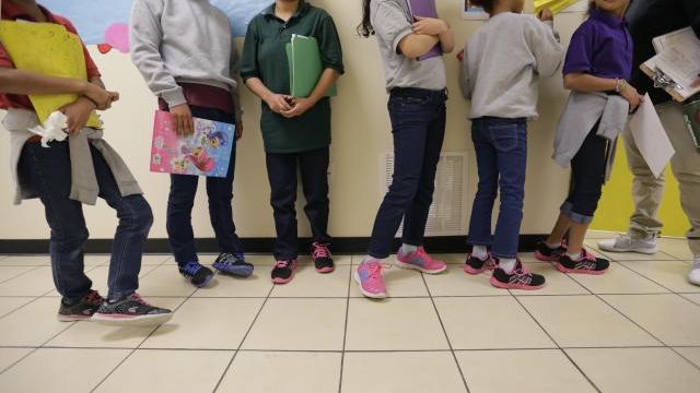FILE - Migrant teens line up for a class at a "tender-age" facility for babies, children and teens, in Texas' Rio Grande Valley, in San Benito, Texas, Aug. 29, 2019. The Biden administration struggled to properly vet and monitor the homes where they placed a surge of migrant children who arrived at the U.S.-Mexico border in 2021. That's according to a federal watchdog report released Thursday. (AP Photo/Eric Gay File) FILE - Migrant teens line up for a class at a "tender-age" facility for babies, children and teens, in Texas' Rio Grande Valley, in San Benito, Texas, Aug. 29, 2019. The Biden administration struggled to properly vet and monitor the homes where they placed a surge of migrant children who arrived at the U.S.-Mexico border in 2021. That's according to a federal watchdog report released Thursday. (AP Photo/Eric Gay File)