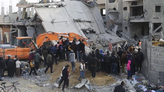 Palestinians look at the destruction after an Israeli strike on a residential building in Rafah, Gaza Strip, Friday, Feb. 16, 2024. (AP Photo/Hatem Ali) Palestinians look at the destruction after an Israeli strike on a residential building in Rafah, Gaza Strip, Friday, Feb. 16, 2024. (AP Photo/Hatem Ali)