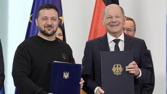 German Chancellor Olaf Scholz, right, and Ukrainian President Volodymyr Zelenskyy display the treaties they signed in the chancellory in Berlin, Germany, Friday, Feb.16, 2024.(AP Photo/Markus Schreiber) German Chancellor Olaf Scholz, right, and Ukrainian President Volodymyr Zelenskyy display the treaties they signed in the chancellory in Berlin, Germany, Friday, Feb.16, 2024.(AP Photo/Markus Schreiber)