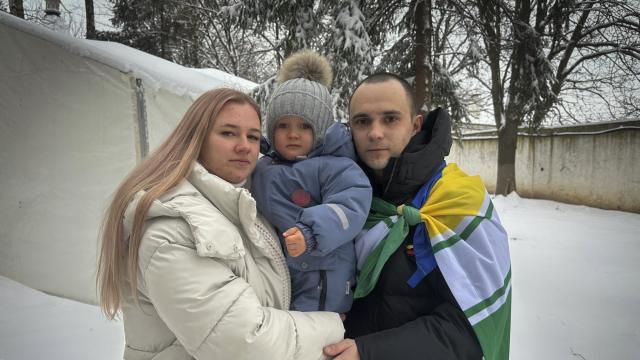 Kateryna Dmytryk, left, and husband Artem Dmytryk hold their son, Timur, after Artem was released from Russian captivity as a part of a prisoner swap in Kyiv, Ukraine, Feb. 9, 2024. (AP Photo/Vasilisa Stepanenko) Kateryna Dmytryk, left, and husband Artem Dmytryk hold their son, Timur, after Artem was released from Russian captivity as a part of a prisoner swap in Kyiv, Ukraine, Feb. 9, 2024. (AP Photo/Vasilisa Stepanenko)