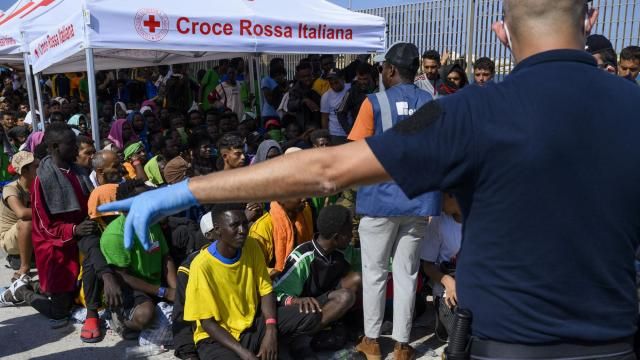 FILE - Migrants wait to be transferred from Lampedusa Island, Italy, Sept. 15, 2023. Albania has agreed to host two migrant processing centers on its territory that will be run by Italy under a deal that worries human rights activists. The European Union, however, sees it as a possible future template. (AP Photo/Valeria Ferraro, File) FILE - Migrants wait to be transferred from Lampedusa Island, Italy, Sept. 15, 2023. Albania has agreed to host two migrant processing centers on its territory that will be run by Italy under a deal that worries human rights activists. The European Union, however, sees it as a possible future template. (AP Photo/Valeria Ferraro, File)