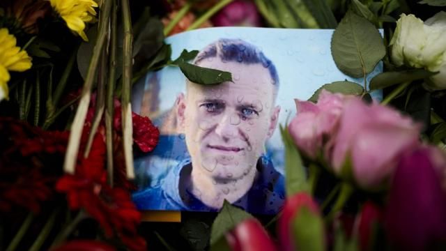 Rain drops cover a portrait of Russian opposition leader Alexei Navalny, placing between flowers in front of the Russian embassy in Berlin, Wednesday, Feb. 21, 2024. German parliament Bundestag is discussing about consequences of Navalny's dead at a prison on Friday. (AP Photo/Markus Schreiber) Rain drops cover a portrait of Russian opposition leader Alexei Navalny, placing between flowers in front of the Russian embassy in Berlin, Wednesday, Feb. 21, 2024. German parliament Bundestag is discussing about consequences of Navalny's dead at a prison on Friday. (AP Photo/Markus Schreiber)