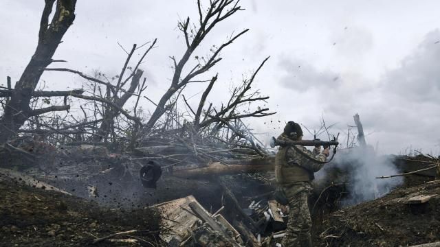 FILE - A Ukrainian soldier fires an RPG toward Russian positions at the frontline near Avdiivka, an eastern city where fierce battles against Russian forces have been taking place, in the Donetsk region, Ukraine, on April 28, 2023. Two years after Russia’s full-scale invasion captured nearly a quarter of the country, the stakes could not be higher for Kyiv. After a string of victories in the first year of the war, fortunes have turned for the Ukrainian military, which is dug in, outgunned and outnumbered against a more powerful opponent. (AP Photo/Libkos, File) FILE - A Ukrainian soldier fires an RPG toward Russian positions at the frontline near Avdiivka, an eastern city where fierce battles against Russian forces have been taking place, in the Donetsk region, Ukraine, on April 28, 2023. Two years after Russia’s full-scale invasion captured nearly a quarter of the country, the stakes could not be higher for Kyiv. After a string of victories in the first year of the war, fortunes have turned for the Ukrainian military, which is dug in, outgunned and outnumbered against a more powerful opponent. (AP Photo/Libkos, File)