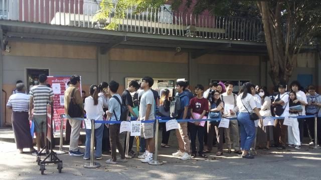 People wait in line to enter into the Thai Embassy for visa appointments in Yangon, Myanmar, Tuesday, Feb. 20, 2024. Crowds of people have thronged to get passports and visas to neighboring Thailand in the two weeks since the government activated a law making at least 14 million young people subject to conscription.(AP Photo) People wait in line to enter into the Thai Embassy for visa appointments in Yangon, Myanmar, Tuesday, Feb. 20, 2024. Crowds of people have thronged to get passports and visas to neighboring Thailand in the two weeks since the government activated a law making at least 14 million young people subject to conscription.(AP Photo)