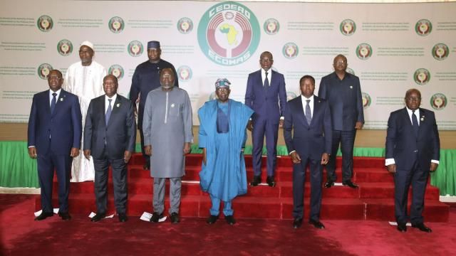 Nigeria's President, Bola Ahmed Tinubu, third from left, first row, poses for a group photo with other West African leaders, prior to the start of the ECOWAS meeting, in Abuja, Nigeria, Saturday, Feb. 24, 2024. Heads of state across West Africa were met on Saturday to discuss the region's existential challenges with a renewed plea on junta-led nations to rescind their decision to quit the regional bloc and a plan to review of sanctions it imposed to reverse the coup in Niger. (AP Photo/Gbemiga Olamikan) Nigeria's President, Bola Ahmed Tinubu, third from left, first row, poses for a group photo with other West African leaders, prior to the start of the ECOWAS meeting, in Abuja, Nigeria, Saturday, Feb. 24, 2024. Heads of state across West Africa were met on Saturday to discuss the region's existential challenges with a renewed plea on junta-led nations to rescind their decision to quit the regional bloc and a plan to review of sanctions it imposed to reverse the coup in Niger. (AP Photo/Gbemiga Olamikan)