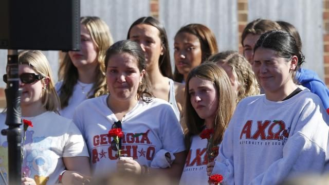 Alpha Chi Omega sorority members mourn the loss of their sorority sister, Laken Riley, during a vigil for the Augusta University College of Nursing student at the Tate Plaza on the University of Georgia campus in Athens, Ga., Monday, Feb. 26, 2024. Riley, a nursing student at Augusta University's Athens campus, was found dead Thursday, Feb. 22, after a roommate reported she didn't return from a morning run in a wooded area of the UGA campus near its intramural fields. Students also gathered to pay tribute to a UGA student who committed suicide last week. (Joshua L. Jones/Athens Banner-Herald via AP) Alpha Chi Omega sorority members mourn the loss of their sorority sister, Laken Riley, during a vigil for the Augusta University College of Nursing student at the Tate Plaza on the University of Georgia campus in Athens, Ga., Monday, Feb. 26, 2024. Riley, a nursing student at Augusta University's Athens campus, was found dead Thursday, Feb. 22, after a roommate reported she didn't return from a morning run in a wooded area of the UGA campus near its intramural fields. Students also gathered to pay tribute to a UGA student who committed suicide last week. (Joshua L. Jones/Athens Banner-Herald via AP)