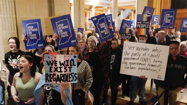 FILE - Protesters stand outside of the Senate chamber at the Indiana Statehouse, Feb. 22, 2023, in Indianapolis. On Tuesday, Feb. 27, 2024, a federal appeals court in Chicago stayed an injunction from an Indiana district court that blocked most of the state's ban on gender-affirming care for minors, allowing the ban to take effect. (AP Photo/Darron Cummings, File) FILE - Protesters stand outside of the Senate chamber at the Indiana Statehouse, Feb. 22, 2023, in Indianapolis. On Tuesday, Feb. 27, 2024, a federal appeals court in Chicago stayed an injunction from an Indiana district court that blocked most of the state's ban on gender-affirming care for minors, allowing the ban to take effect. (AP Photo/Darron Cummings, File)