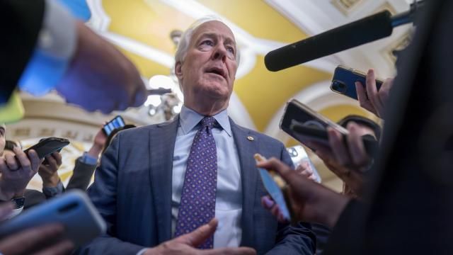 FILE - Sen. John Cornyn, R-Texas, is surrounded by reporters as he heads to the chamber at the Capitol in Washington, Feb. 7, 2024. (AP Photo/J. Scott Applewhite, File) FILE - Sen. John Cornyn, R-Texas, is surrounded by reporters as he heads to the chamber at the Capitol in Washington, Feb. 7, 2024. (AP Photo/J. Scott Applewhite, File)