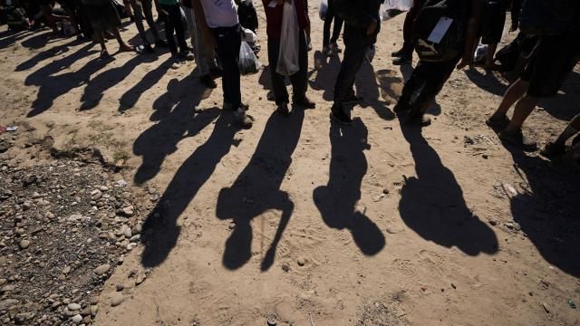 FILE - Migrants wait to be processed by the U.S. Customs and Border Patrol after they crossed the Rio Grande and entered the U.S. from Mexico, Oct. 19, 2023, in Eagle Pass, Texas. The U.S. 5th Circuit Court of Appeals on Thursday, Feb. 29, 2024, allowed a Texas law to proceed that lets state police arrest migrants and local judges to order them to leave, paving the way to a U.S. Supreme Court battle. The law, which was initially set to take effect Tuesday, March 5, will be able to take effect Saturday, March 9. (AP Photo/Eric Gay, File) FILE - Migrants wait to be processed by the U.S. Customs and Border Patrol after they crossed the Rio Grande and entered the U.S. from Mexico, Oct. 19, 2023, in Eagle Pass, Texas. The U.S. 5th Circuit Court of Appeals on Thursday, Feb. 29, 2024, allowed a Texas law to proceed that lets state police arrest migrants and local judges to order them to leave, paving the way to a U.S. Supreme Court battle. The law, which was initially set to take effect Tuesday, March 5, will be able to take effect Saturday, March 9. (AP Photo/Eric Gay, File)