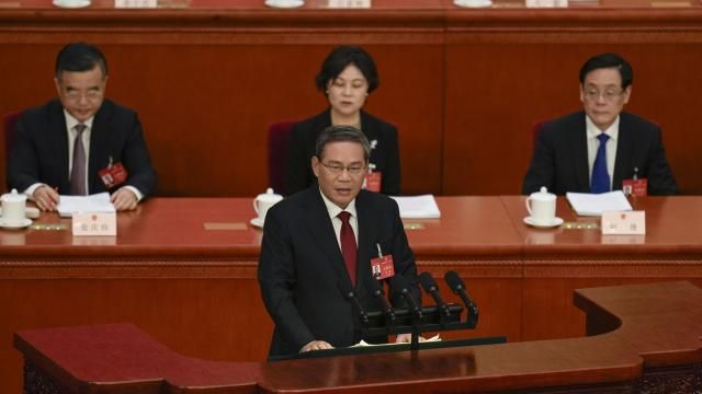 Chinese Premier Li Qiang, center, speaks during the opening session of the National People's Congress (NPC) at the Great Hall of the People in Beijing, China, Tuesday, March 5, 2024. (AP Photo/Ng Han Guan) Chinese Premier Li Qiang, center, speaks during the opening session of the National People's Congress (NPC) at the Great Hall of the People in Beijing, China, Tuesday, March 5, 2024. (AP Photo/Ng Han Guan)