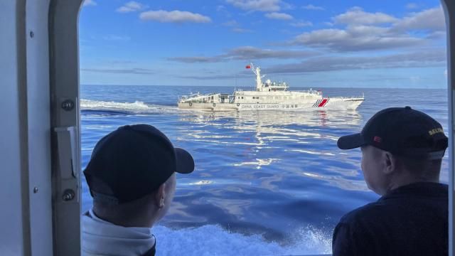 FILE - A Chinese coast guard vessel maneuvers beside the Philippine coast guard ship BRP Cabra as they approach the Second Thomas Shoal, locally known as Ayungin Shoal, during a resupply mission on the disputed South China Sea on Nov. 10, 2023. Chinese coast guard ships blocked Philippine vessels from a disputed South China Sea shoal Tuesday, March 5, 2024, causing a minor collision, Philippine officials said. (AP Photo/Jim Gomez, File) FILE - A Chinese coast guard vessel maneuvers beside the Philippine coast guard ship BRP Cabra as they approach the Second Thomas Shoal, locally known as Ayungin Shoal, during a resupply mission on the disputed South China Sea on Nov. 10, 2023. Chinese coast guard ships blocked Philippine vessels from a disputed South China Sea shoal Tuesday, March 5, 2024, causing a minor collision, Philippine officials said. (AP Photo/Jim Gomez, File)