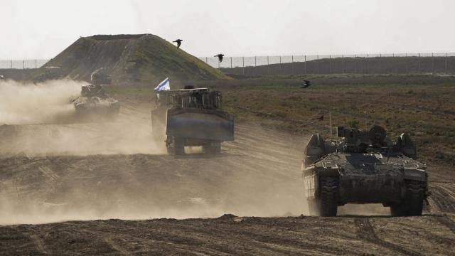FILE - Israeli troops move near the Gaza Strip border in southern Israel, Monday, March 4, 2024. The army is battling Palestinian militants across Gaza in the war ignited by Hamas' Oct. 7 attack into Israel. Israel can either try to annihilate Hamas, which would mean almost certain death for the estimated 100 hostages still held in Gaza, or it can cut a deal that would allow the militants to claim a historic victory. Either outcome would be excruciating for Israelis. And either might be seen as acceptable by Hamas, which valorizes martyrdom. (AP Photo/Ohad Zwigenberg, File) FILE - Israeli troops move near the Gaza Strip border in southern Israel, Monday, March 4, 2024. The army is battling Palestinian militants across Gaza in the war ignited by Hamas' Oct. 7 attack into Israel. Israel can either try to annihilate Hamas, which would mean almost certain death for the estimated 100 hostages still held in Gaza, or it can cut a deal that would allow the militants to claim a historic victory. Either outcome would be excruciating for Israelis. And either might be seen as acceptable by Hamas, which valorizes martyrdom. (AP Photo/Ohad Zwigenberg, File)