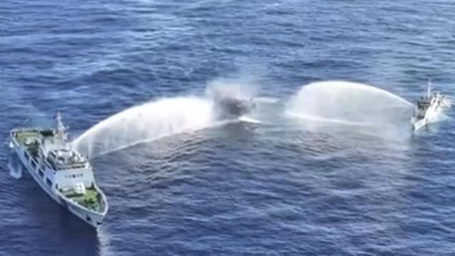 In this image made from video provided by the Philippine Coast Guard, Philippine resupply vessel Unaizah May 4, center, is hit by two Chinese coast guard water canon blasts, causing injuries to multiple crew members as they tried to enter the Second Thomas Shoal, locally known as Ayungin Shoal, in the disputed South China Sea, Tuesday, March 5, 2024. Chinese and Philippine coast guard vessels collided in the disputed South China Sea and multiple Filipino crew members were injured in high-seas confrontations Tuesday as Southeast Asian leaders gathered for a summit that was expected to touch on Beijing's aggression at sea. (Philippine Coast Guard via AP) In this image made from video provided by the Philippine Coast Guard, Philippine resupply vessel Unaizah May 4, center, is hit by two Chinese coast guard water canon blasts, causing injuries to multiple crew members as they tried to enter the Second Thomas Shoal, locally known as Ayungin Shoal, in the disputed South China Sea, Tuesday, March 5, 2024. Chinese and Philippine coast guard vessels collided in the disputed South China Sea and multiple Filipino crew members were injured in high-seas confrontations Tuesday as Southeast Asian leaders gathered for a summit that was expected to touch on Beijing's aggression at sea. (Philippine Coast Guard via AP)