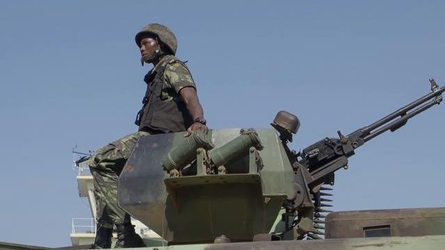 FILE - In this image made from video, a Mozambican soldier rides on an armored vehicle at the airport in Mocimboa da Praia, Cabo Delgado province, Mozambique, Aug. 9, 2021. Aid agencies and local authorities say a surge of new attacks by an Islamic State-affiliated group in northern Mozambique has left more than 70 children missing and caused 100,000 people to flee their homes. There are fears the children may have drowned in a river or been kidnapped by militants, the aids groups said in a report on Wednesday March 6, 2024. (AP Photo/Marc Hoogsteyns, File) FILE - In this image made from video, a Mozambican soldier rides on an armored vehicle at the airport in Mocimboa da Praia, Cabo Delgado province, Mozambique, Aug. 9, 2021. Aid agencies and local authorities say a surge of new attacks by an Islamic State-affiliated group in northern Mozambique has left more than 70 children missing and caused 100,000 people to flee their homes. There are fears the children may have drowned in a river or been kidnapped by militants, the aids groups said in a report on Wednesday March 6, 2024. (AP Photo/Marc Hoogsteyns, File)