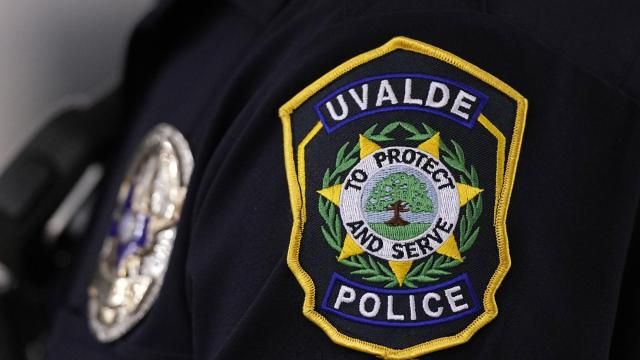 A Uvalde police officers patch a badge are seen as he stands watch over a special city council meeting in Uvalde, Texas, Thursday, March 7, 2024. Almost two years after the deadly school shooting in Uvalde that left 19 children and two teachers dead, the city council met to discuss the results of an independent investigation it requested into the response by local police officers. (AP Photo/Eric Gay) A Uvalde police officers patch a badge are seen as he stands watch over a special city council meeting in Uvalde, Texas, Thursday, March 7, 2024. Almost two years after the deadly school shooting in Uvalde that left 19 children and two teachers dead, the city council met to discuss the results of an independent investigation it requested into the response by local police officers. (AP Photo/Eric Gay)