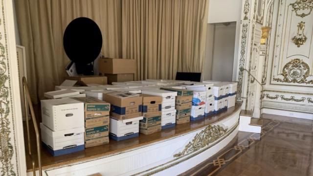 This image, contained in the indictment against former President Donald Trump, and partially redacted by source, shows boxes of records being stored on the stage in the White and Gold Ballroom at Trump's Mar-a-Lago estate in Palm Beach, Fla. (Justice Department via AP) This image, contained in the indictment against former President Donald Trump, and partially redacted by source, shows boxes of records being stored on the stage in the White and Gold Ballroom at Trump's Mar-a-Lago estate in Palm Beach, Fla. (Justice Department via AP)