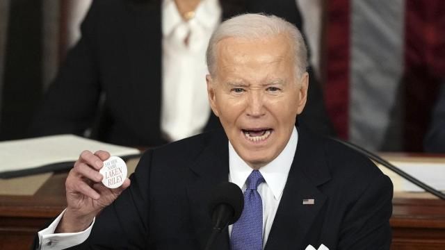 President Joe Biden holds up a Laken Riley Botton as he delivers the State of the Union address to a joint session of Congress at the U.S. Capitol, Thursday March 7, 2024, in Washington. (AP Photo/Andrew Harnik) President Joe Biden holds up a Laken Riley Botton as he delivers the State of the Union address to a joint session of Congress at the U.S. Capitol, Thursday March 7, 2024, in Washington. (AP Photo/Andrew Harnik)