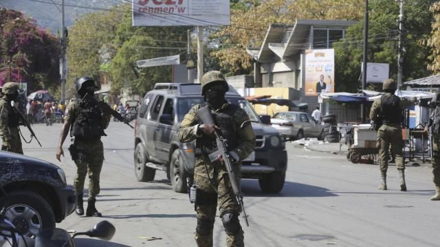 Members of the General Security Unit of the National Palace, USGPN, set up a security perimeter around one of the three downtown stations after police fought off an attack by gangs the day before, in Port-au-Prince, Haiti, Saturday, March 9, 2024. (AP Photo/Odelyn Joseph) Members of the General Security Unit of the National Palace, USGPN, set up a security perimeter around one of the three downtown stations after police fought off an attack by gangs the day before, in Port-au-Prince, Haiti, Saturday, March 9, 2024. (AP Photo/Odelyn Joseph)