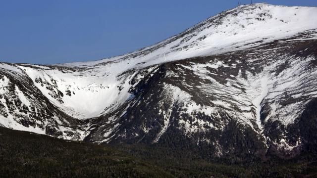 FILE - Tuckerman Ravine is seen at left, about one mile below the summit of 6,288-foot Mount Washington, in New Hampshire, Monday, May 4, 2015. (AP Photo/Robert F. Bukaty, File) FILE - Tuckerman Ravine is seen at left, about one mile below the summit of 6,288-foot Mount Washington, in New Hampshire, Monday, May 4, 2015. (AP Photo/Robert F. Bukaty, File)