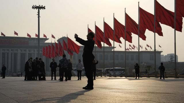 A man takes photos near red flags on Tiananmen Square before the closing session of the Chinese People's Political Consultative Conference (CPPCC) in Beijing, Sunday, March 10, 2024. The CPPCC is an advisory body to the National People's Congress which will close Monday. (AP Photo/Ng Han Guan) A man takes photos near red flags on Tiananmen Square before the closing session of the Chinese People's Political Consultative Conference (CPPCC) in Beijing, Sunday, March 10, 2024. The CPPCC is an advisory body to the National People's Congress which will close Monday. (AP Photo/Ng Han Guan)