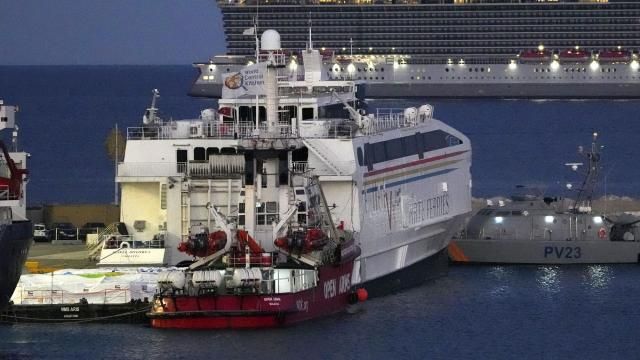 Aid packages are seen at left, on a platform near to the docked ship belonging to the Open Arms aid group, center front, as it prepares to ferry some 200 tonnes of rice and flour directly to Gaza, at the port in Larnaca, Cyprus, Monday, March 11, 2024. The European Commission president said Friday the Open Arms ship will make a pilot voyage as international donors launched a sea corridor to supply the besieged territory that is facing widespread hunger after five months of war. (AP Photo/Petros Karadjias) Aid packages are seen at left, on a platform near to the docked ship belonging to the Open Arms aid group, center front, as it prepares to ferry some 200 tonnes of rice and flour directly to Gaza, at the port in Larnaca, Cyprus, Monday, March 11, 2024. The European Commission president said Friday the Open Arms ship will make a pilot voyage as international donors launched a sea corridor to supply the besieged territory that is facing widespread hunger after five months of war. (AP Photo/Petros Karadjias)