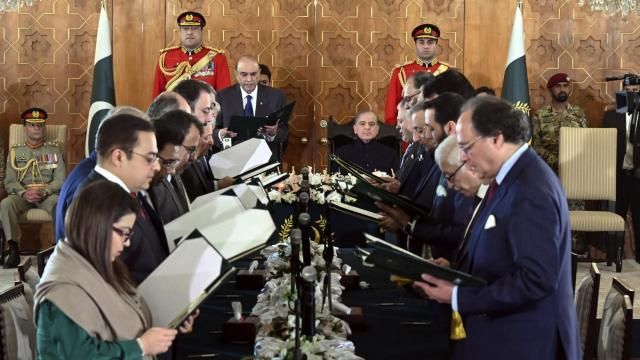 In this photo released by the Pakistan's President Office, President Asif Ali Zardari, center left, administers the oath from federal ministers as Prime Minister Shehbaz Sharif, center right, watches during a ceremony at the Presidential Palace, in Islamabad, Pakistan, Monday, March 11, 2024. The 19-member Cabinet of Pakistan's newly-elected Prime Minister Sharif was sworn in Monday during a brief ceremony. (Pakistan's President Office via AP) In this photo released by the Pakistan's President Office, President Asif Ali Zardari, center left, administers the oath from federal ministers as Prime Minister Shehbaz Sharif, center right, watches during a ceremony at the Presidential Palace, in Islamabad, Pakistan, Monday, March 11, 2024. The 19-member Cabinet of Pakistan's newly-elected Prime Minister Sharif was sworn in Monday during a brief ceremony. (Pakistan's President Office via AP)