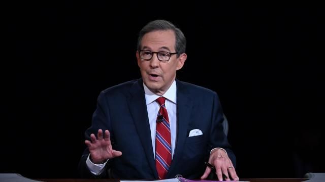 FILE - Moderator Chris Wallace speaks as President Donald Trump and Democratic presidential candidate former Vice President Joe Biden participate in the first presidential debate in Cleveland on Sept. 29, 2020. Wallace has written a book on the race between John F. Kennedy and Richard Nixon. The race was narrowly won by Kennedy and featured the first televised presidential debates. Dutton announced Wednesday that “Countdown 1960: The Behind-the-Scenes Story of the 311 Days that Changed America’s Politics Forever” will be published Oct. 8. (Olivier Douliery/Pool via AP, File) FILE - Moderator Chris Wallace speaks as President Donald Trump and Democratic presidential candidate former Vice President Joe Biden participate in the first presidential debate in Cleveland on Sept. 29, 2020. Wallace has written a book on the race between John F. Kennedy and Richard Nixon. The race was narrowly won by Kennedy and featured the first televised presidential debates. Dutton announced Wednesday that “Countdown 1960: The Behind-the-Scenes Story of the 311 Days that Changed America’s Politics Forever” will be published Oct. 8. (Olivier Douliery/Pool via AP, File)