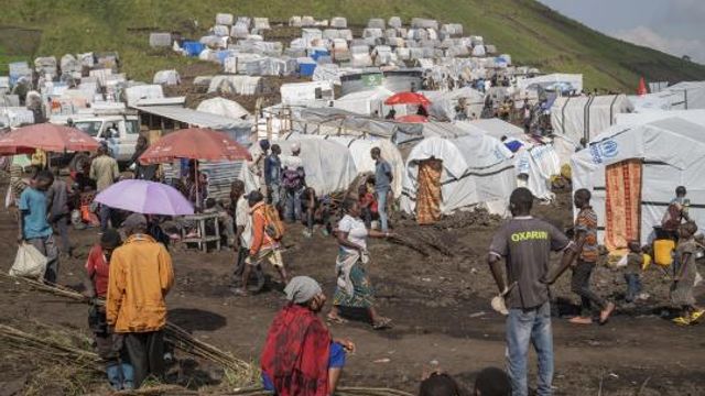 People displaced by the ongoing fighting between Congolese forces and M23 rebels gather in a camp on the outskirts of Goma, Democratic Republic of Congo, Wednesday, March 13, 2024, as OCHA (United Nations Office for the Coordination of Humanitarian Affairs) head and representative Ramesh Rajasingham, carries out a working visit to the region. (AP Photo/Moses Sawasawa) People displaced by the ongoing fighting between Congolese forces and M23 rebels gather in a camp on the outskirts of Goma, Democratic Republic of Congo, Wednesday, March 13, 2024, as OCHA (United Nations Office for the Coordination of Humanitarian Affairs) head and representative Ramesh Rajasingham, carries out a working visit to the region. (AP Photo/Moses Sawasawa)