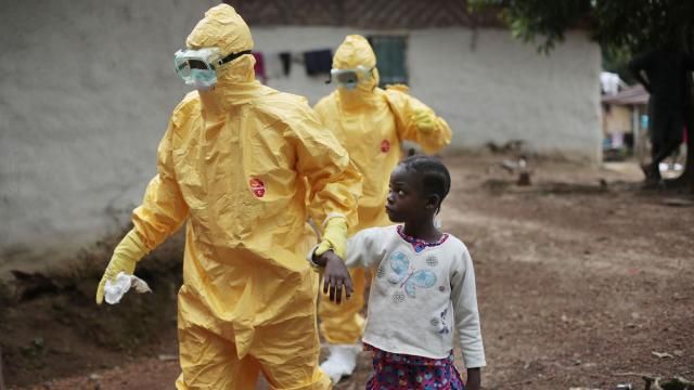 FILE - Nowa Paye, 9, is taken to an ambulance after showing signs of the Ebola infection in the village of Freeman Reserve, about 30 miles north of Monrovia, Liberia, on Sept. 30, 2014. Liberians gathered Wednesday, March 13, 2024 to commemorate a decade since the country was first hit by a devastating outbreak of Ebola that killed thousands in West Africa, adding to the region's economic and political troubles. (AP Photo/Jerome Delay, File) FILE - Nowa Paye, 9, is taken to an ambulance after showing signs of the Ebola infection in the village of Freeman Reserve, about 30 miles north of Monrovia, Liberia, on Sept. 30, 2014. Liberians gathered Wednesday, March 13, 2024 to commemorate a decade since the country was first hit by a devastating outbreak of Ebola that killed thousands in West Africa, adding to the region's economic and political troubles. (AP Photo/Jerome Delay, File)
