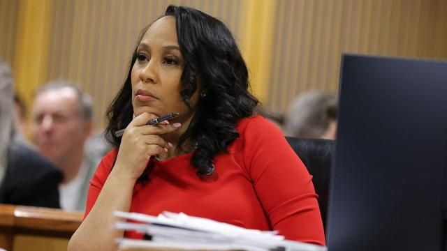 FILE - Fulton County District Attorney Fani Willis looks on during a hearing on the Georgia election interference case, Friday, March, 1, 2024, in Atlanta. A progressive Democrat and a Republican who briefly worked in Donald Trump's administration entered the Fulton County district attorney's race Friday, March 8, 2024, as the current officeholder, Willis, awaits a judge's decision on whether she will be removed from the Georgia election interference case against the former president. (AP Photo/Alex Slitz, Pool, File) FILE - Fulton County District Attorney Fani Willis looks on during a hearing on the Georgia election interference case, Friday, March, 1, 2024, in Atlanta. A progressive Democrat and a Republican who briefly worked in Donald Trump's administration entered the Fulton County district attorney's race Friday, March 8, 2024, as the current officeholder, Willis, awaits a judge's decision on whether she will be removed from the Georgia election interference case against the former president. (AP Photo/Alex Slitz, Pool, File)