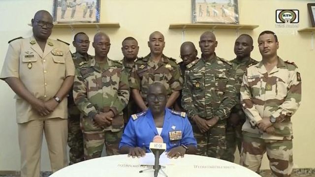 FILE - In this image taken from video provided by ORTN, Col. Maj. Amadou Abdramane, front center, makes a statement on July 26, 2023, in Niamey, Niger, as a delegation of military officers appeared on Niger State TV to read out a series of communiques announcing their coup d'etat. The U.S. is scrambling to assess the future of its counterterrorism operations in the Sahel region of Africa after the ruling junta in Niger announced it was ending military cooperation with Washington. (ORTN via AP, File) FILE - In this image taken from video provided by ORTN, Col. Maj. Amadou Abdramane, front center, makes a statement on July 26, 2023, in Niamey, Niger, as a delegation of military officers appeared on Niger State TV to read out a series of communiques announcing their coup d'etat. The U.S. is scrambling to assess the future of its counterterrorism operations in the Sahel region of Africa after the ruling junta in Niger announced it was ending military cooperation with Washington. (ORTN via AP, File)