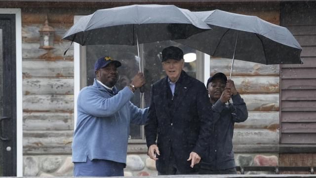 President Joe Biden poses for a photo with Hurley "HJ" Coleman IV and his father Hurley Coleman III, left, as he arrives for a campaign event at Pleasant View Golf Club in Saginaw, Mich., Thursday, March 14, 2024. (AP Photo/Jacquelyn Martin) President Joe Biden poses for a photo with Hurley "HJ" Coleman IV and his father Hurley Coleman III, left, as he arrives for a campaign event at Pleasant View Golf Club in Saginaw, Mich., Thursday, March 14, 2024. (AP Photo/Jacquelyn Martin)