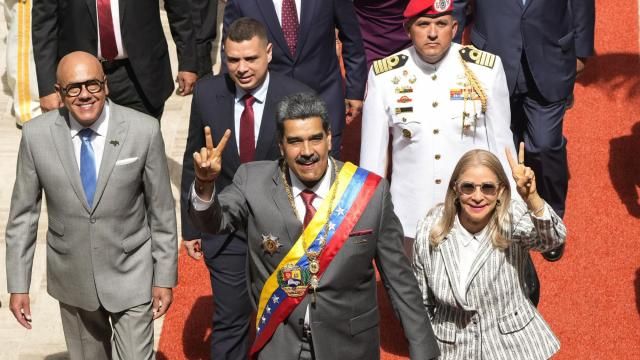 FILE - Venezuelan President Nicolas Maduro and first lady Cilia Flores flash victory signs as they arrive to the National Assembly for the annual presidential address, in Caracas, Venezuela, Jan. 15, 2024. As the July 28 presidential election nears, Venezuelan government keeps arresting opponents allegedly tied to criminal plots. (AP Photo/Ariana Cubillos, File) FILE - Venezuelan President Nicolas Maduro and first lady Cilia Flores flash victory signs as they arrive to the National Assembly for the annual presidential address, in Caracas, Venezuela, Jan. 15, 2024. As the July 28 presidential election nears, Venezuelan government keeps arresting opponents allegedly tied to criminal plots. (AP Photo/Ariana Cubillos, File)