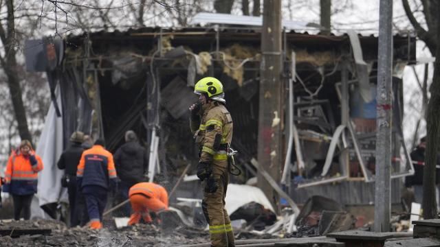A firefighter stands amongst the debris after a Russian attack in Kyiv, Ukraine, Thursday, March 21, 2024. Around 30 cruise and ballistic missiles were shot down over Kyiv on Thursday morning, said Serhii Popko, the head of Kyiv City Administration. The missiles were entering Kyiv simultaneously from various directions in a first missile attack on the capital in 44 days. (AP Photo/Vadim Ghirda) A firefighter stands amongst the debris after a Russian attack in Kyiv, Ukraine, Thursday, March 21, 2024. Around 30 cruise and ballistic missiles were shot down over Kyiv on Thursday morning, said Serhii Popko, the head of Kyiv City Administration. The missiles were entering Kyiv simultaneously from various directions in a first missile attack on the capital in 44 days. (AP Photo/Vadim Ghirda)