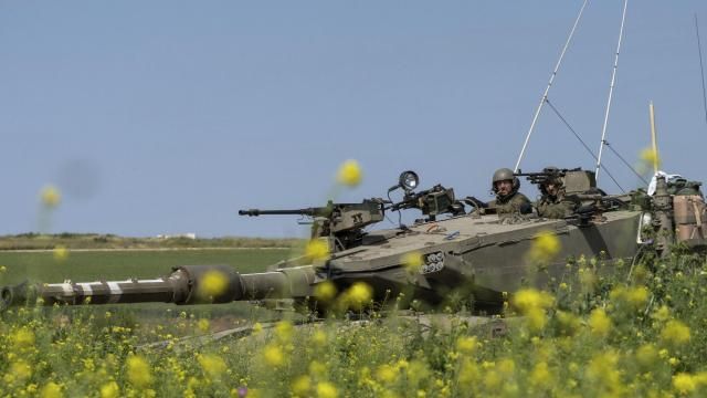 Israeli soldiers move on the top of a tank near the Israeli-Gaza border, as seen from southern Israel, Thursday, March 21, 2024. (AP Photo/Ohad Zwigenberg) Israeli soldiers move on the top of a tank near the Israeli-Gaza border, as seen from southern Israel, Thursday, March 21, 2024. (AP Photo/Ohad Zwigenberg)