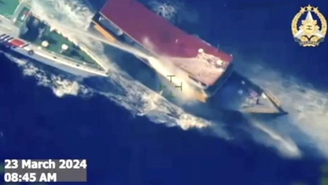 In this screen grab from video provided by the Armed Forces of the Philippines, a Chinese coast guard ship uses water cannons and closely maneuvers beside a Philippine resupply vessel Unaizah May 4 as it approaches Second Thomas Shoal, locally called Ayungin shoal, at the disputed South China Sea on Saturday, March 23, 2024. (Armed Forces of the Philippines via AP) In this screen grab from video provided by the Armed Forces of the Philippines, a Chinese coast guard ship uses water cannons and closely maneuvers beside a Philippine resupply vessel Unaizah May 4 as it approaches Second Thomas Shoal, locally called Ayungin shoal, at the disputed South China Sea on Saturday, March 23, 2024. (Armed Forces of the Philippines via AP)