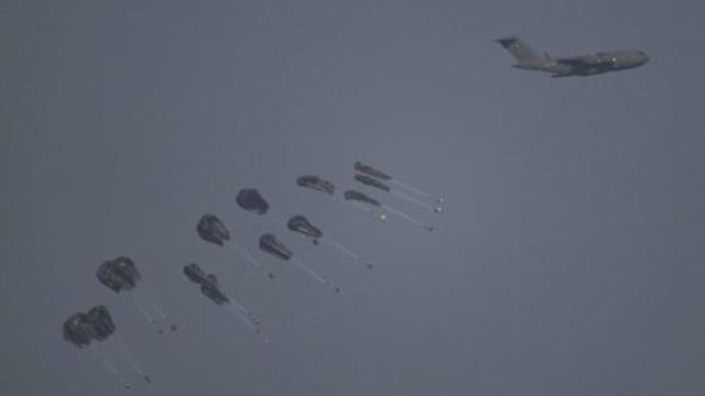 An aircraft airdrops humanitarian aid over northern Gaza Strip as seen from southern Israel, Thursday, March 28, 2024. (AP Photo/Leo Correa) An aircraft airdrops humanitarian aid over northern Gaza Strip as seen from southern Israel, Thursday, March 28, 2024. (AP Photo/Leo Correa)