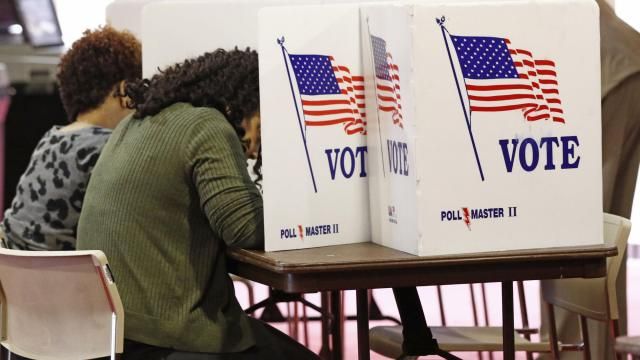 FILE - Voters work on their ballots in kiosks in Jackson, Miss., March 10, 2020. Voters in the pivotal swing state of Wisconsin, as well as Connecticut, New York and Rhode Island, will weigh in on their parties presumptive nominees in presidential primaries Tuesday, April 2, 2024. Further south, Arkansas and Mississippi voters will return to the polls to decide a small handful of legislative seats that were forced to runoffs in primaries held earlier in March. (AP Photo/Rogelio V. Solis, File) FILE - Voters work on their ballots in kiosks in Jackson, Miss., March 10, 2020. Voters in the pivotal swing state of Wisconsin, as well as Connecticut, New York and Rhode Island, will weigh in on their parties presumptive nominees in presidential primaries Tuesday, April 2, 2024. Further south, Arkansas and Mississippi voters will return to the polls to decide a small handful of legislative seats that were forced to runoffs in primaries held earlier in March. (AP Photo/Rogelio V. Solis, File)