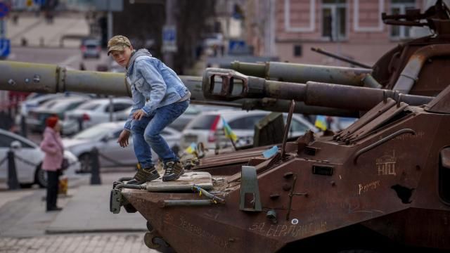 A child climbs on a rusty armored personnel carrier, part of a display of destroyed Russian military equipment in Kyiv, Ukraine, Thursday, March 28, 2024. (AP Photo/Vadim Ghirda) A child climbs on a rusty armored personnel carrier, part of a display of destroyed Russian military equipment in Kyiv, Ukraine, Thursday, March 28, 2024. (AP Photo/Vadim Ghirda)