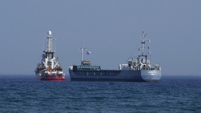 A cargo ship, right, and a ship belonging to the Open Arms aid group, are loaded with 240 tons of canned food destined for Gaza prepare to set sail outside the Cypriot port of Larnaca, Cyprus, on Saturday, March 30, 2024. U.S. charity World Central Kitchen says the ship, named Jennifer, was due to depart following the inaugural voyage of the Cyprus-Gaza sea route earlier this month by the Open Arms vessel that delivered 200 tons of food and water. (AP Photo/Petros Karadjias) A cargo ship, right, and a ship belonging to the Open Arms aid group, are loaded with 240 tons of canned food destined for Gaza prepare to set sail outside the Cypriot port of Larnaca, Cyprus, on Saturday, March 30, 2024. U.S. charity World Central Kitchen says the ship, named Jennifer, was due to depart following the inaugural voyage of the Cyprus-Gaza sea route earlier this month by the Open Arms vessel that delivered 200 tons of food and water. (AP Photo/Petros Karadjias)