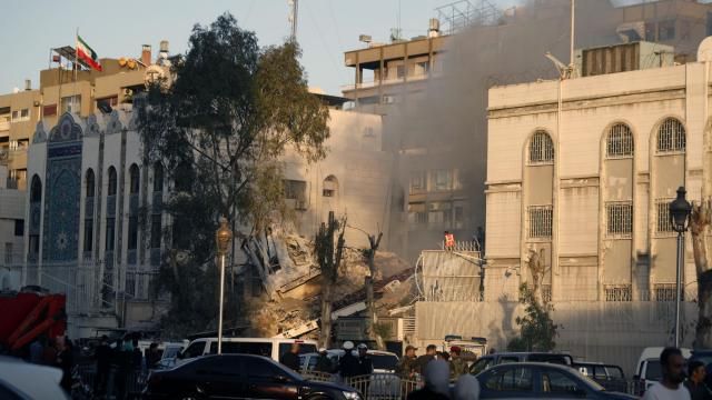Emergency services work at a destroyed building hit by an air strike in Damascus, Syria, Monday, April 1, 2024. An Israeli airstrike has destroyed the consular section of Iran's embassy in Damascus, killing or wounding everyone inside, Syrian state media said Monday. (AP Photo/Omar Sanadiki) Emergency services work at a destroyed building hit by an air strike in Damascus, Syria, Monday, April 1, 2024. An Israeli airstrike has destroyed the consular section of Iran's embassy in Damascus, killing or wounding everyone inside, Syrian state media said Monday. (AP Photo/Omar Sanadiki)